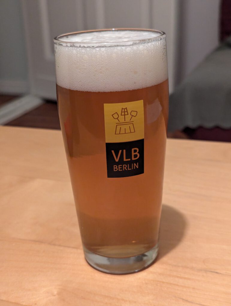 A Willibecher of the Kellerbier. The colour is golden with a tiny bit of haze, with a moderately dense head of foam on top.