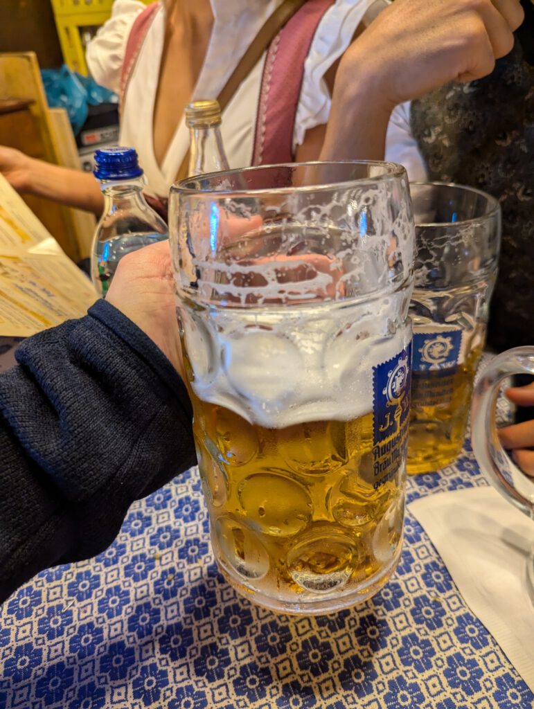 A partially drunk Maß of beer at the Augustiner-Festzelt, 2024