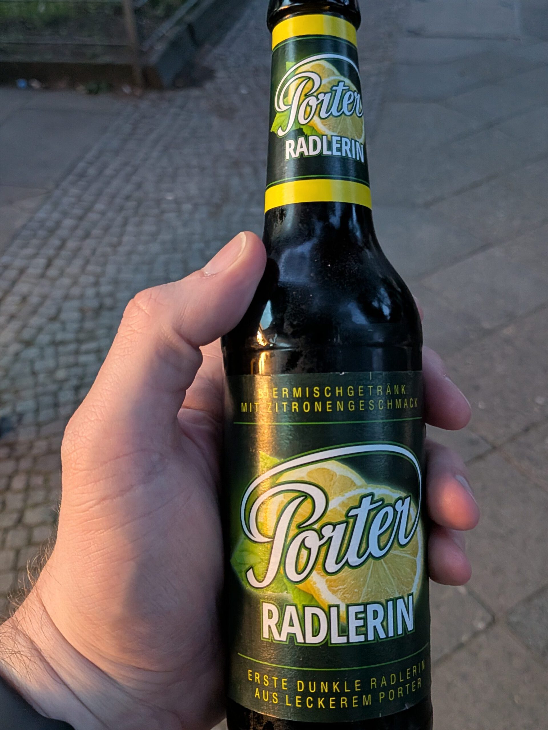 A bottle of Porter Radlerin, "beer mixed drink with lemon flavour", "first dark radler from out Porter".